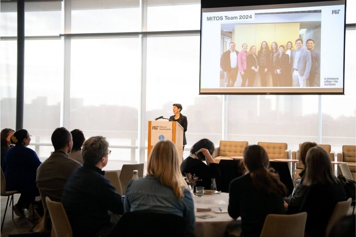 Dr. Julie Newman presenting the MIT Office of Sustainability team to an audience