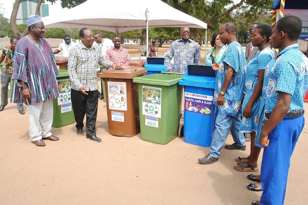 Local community members participating in a waste segregation drive using color-coded recycling bins, highlighting Earth5R’s circular economy initiatives that promote Waste Management, Sustainability, ESG, and CSR practices as a leading NGO in Mumbai.