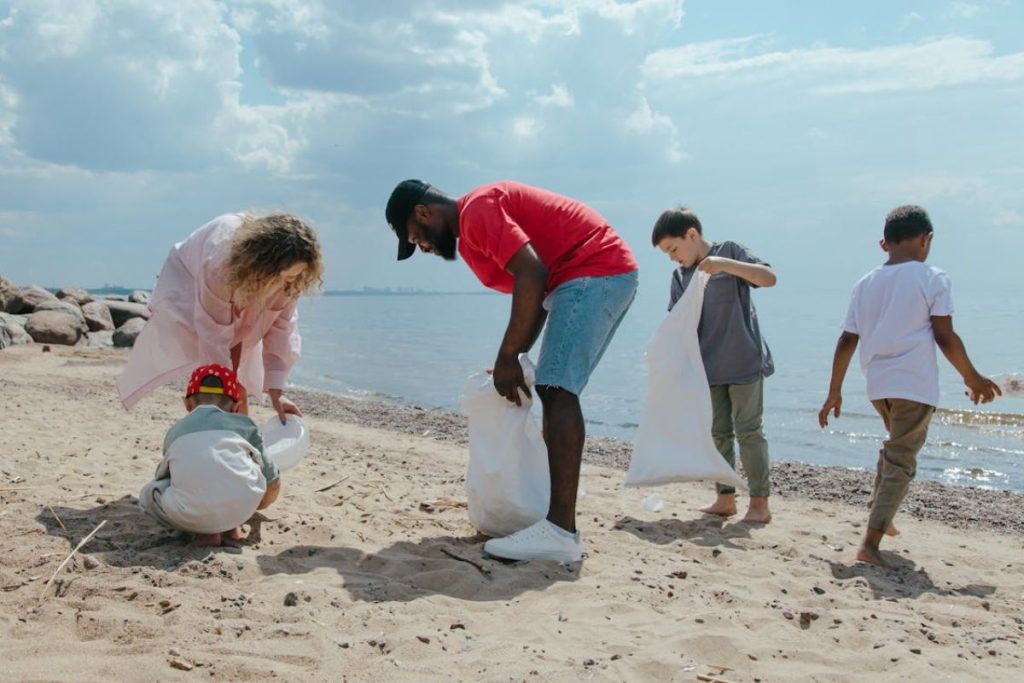A family participates in a beach cleanup, a community action supported by Earth5R, a waste management and sustainability NGO in Mumbai focused on ESG and CSR.