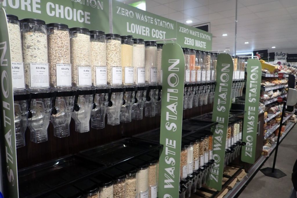 A zero-waste store aisle with bulk bins, showcasing a reuse and refill model for sustainability championed by NGOs like Earth5R in Mumbai as part of their ESG and CSR mission.