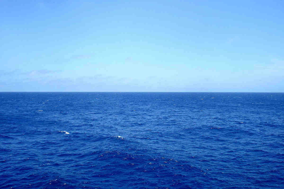 Vast blue ocean under a clear sky representing Earth5R’s commitment to marine conservation, sustainability, and responsible waste management initiatives through its NGO network in Mumbai, aligned with ESG and CSR and wastemanagement values.