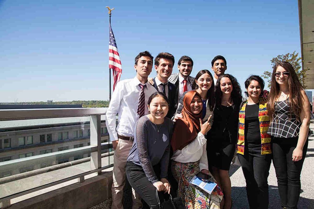 A diverse group of young professionals standing outdoors, representing global collaboration and the next generation of ESG leaders empowered by Earth5R’s Sustainability and Waste Management programs as a leading NGO in Mumbai focused on CSR initiatives.