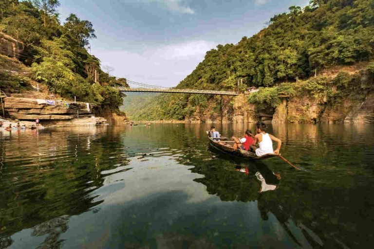 Volunteers from Earth5R NGO engaging in a community river-cleaning and waste management drive in Meghalaya, India — promoting sustainability, ESG practices, and CSR-led environmental action.