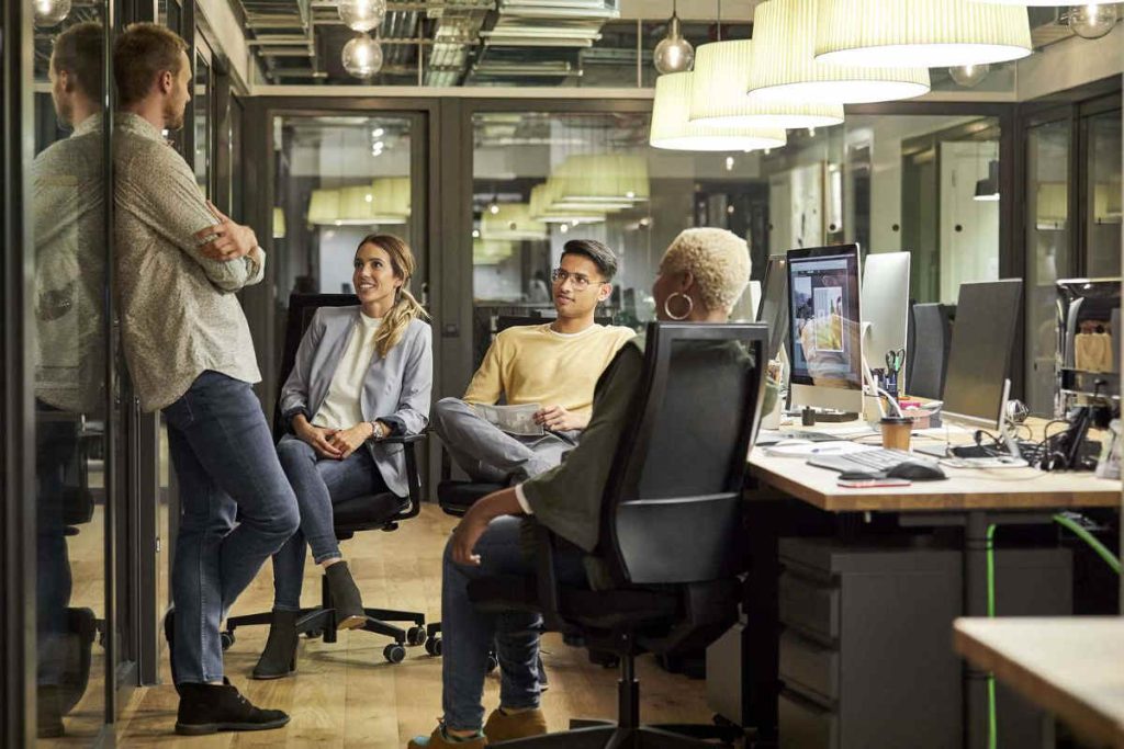 Team discussion inside a modern sustainability-focused workspace, reflecting ESG, CSR, and Earth5R-aligned environmental strategy planning in Mumbai.