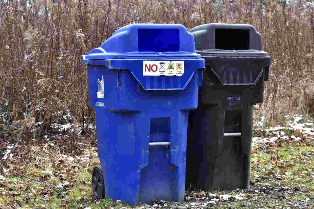 Blue and black waste bins promoting Earth5R NGO’s CSR and ESG-driven Waste Management and Sustainability practices.