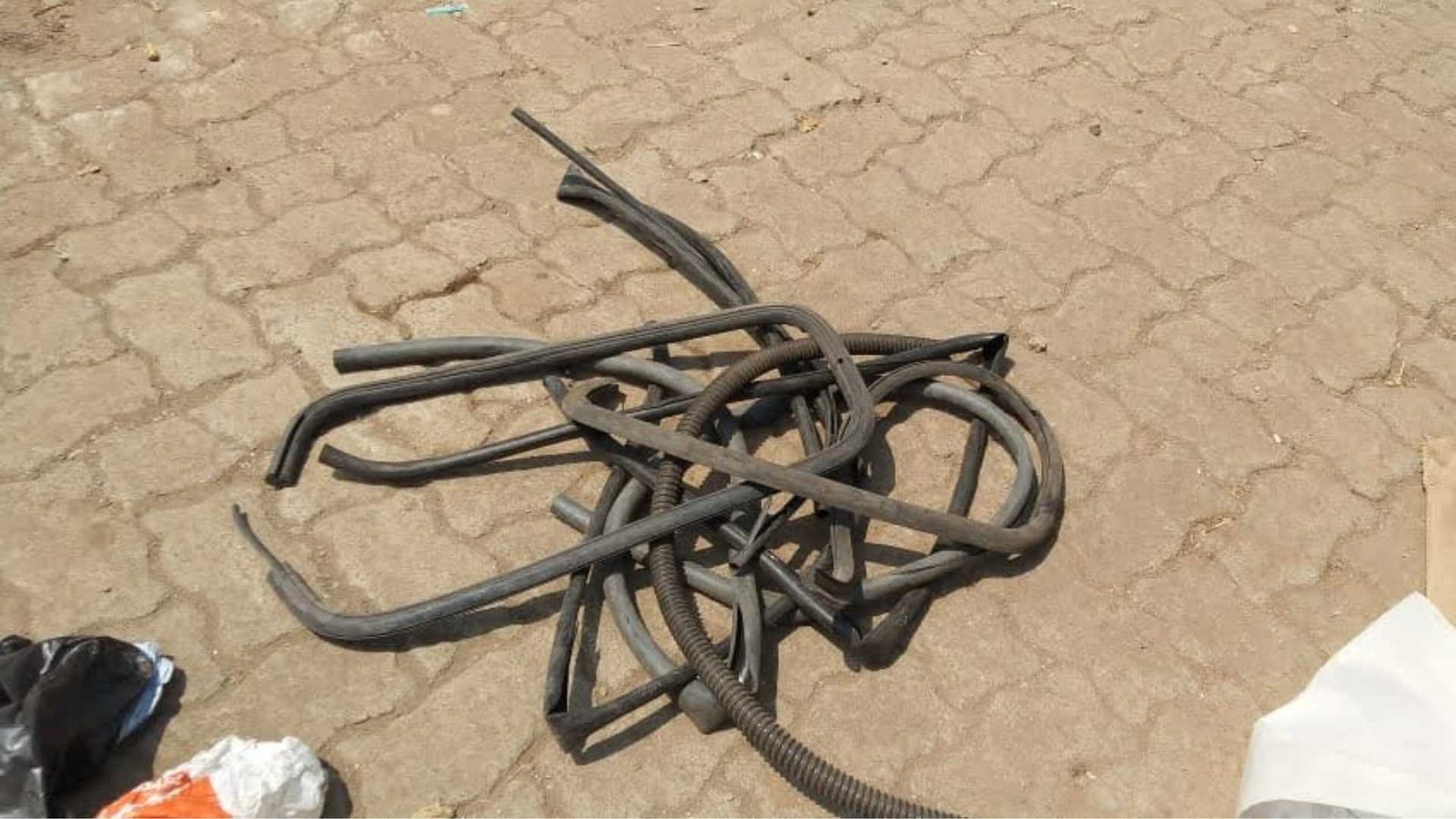 Earth5R volunteers sorting and recycling scrap metal and electronic components from end-of-life vehicles at automobile recycling facility