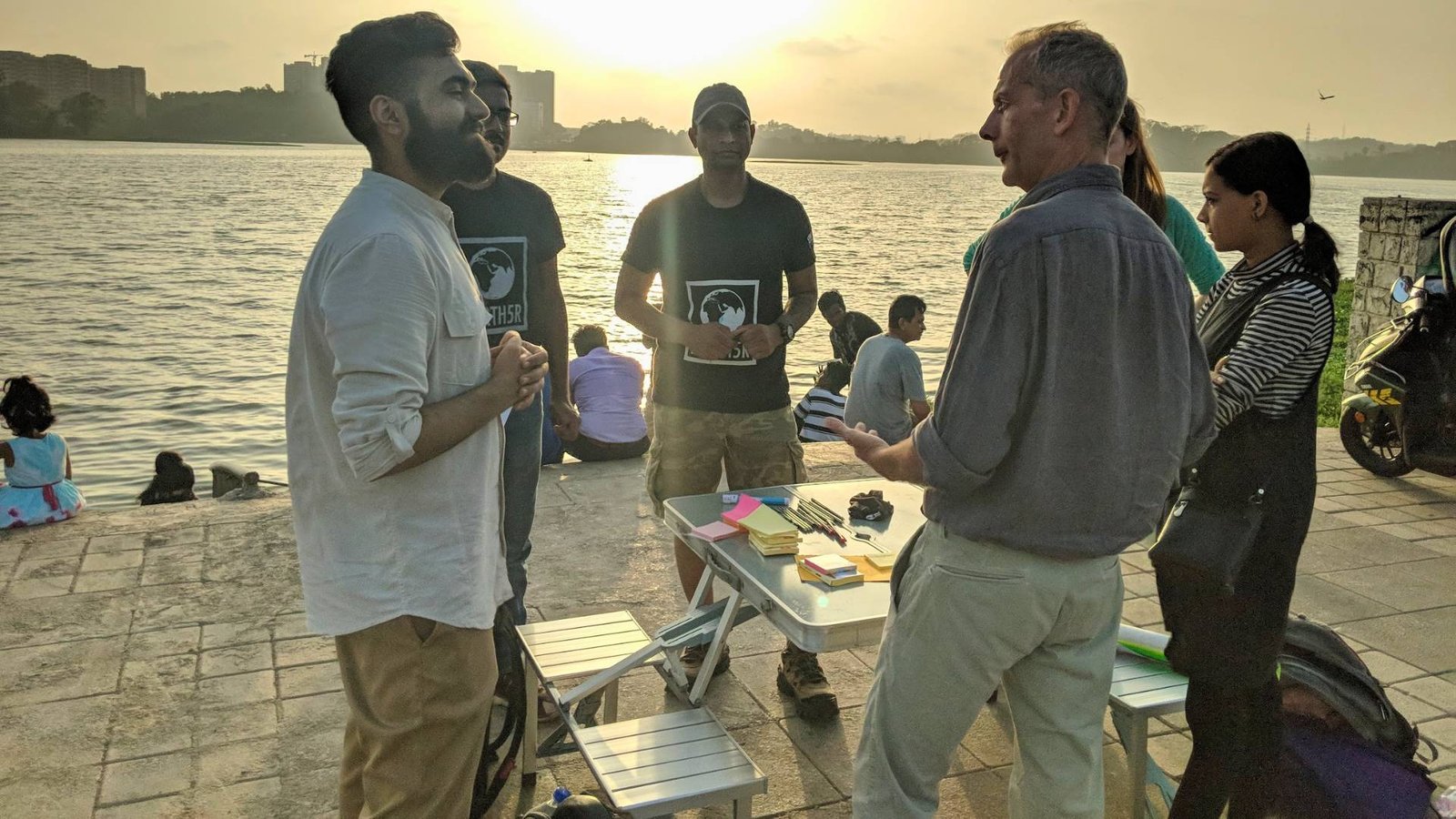 Earth5R team conducting hackathon at riverfront for river cleanup innovation