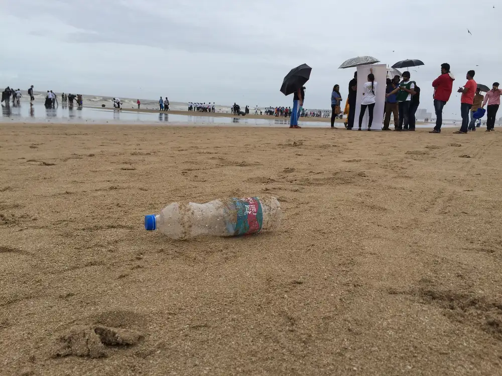 Plastic bottle on Juhu beach before an Earth5R corporate beach cleanup in Mumbai