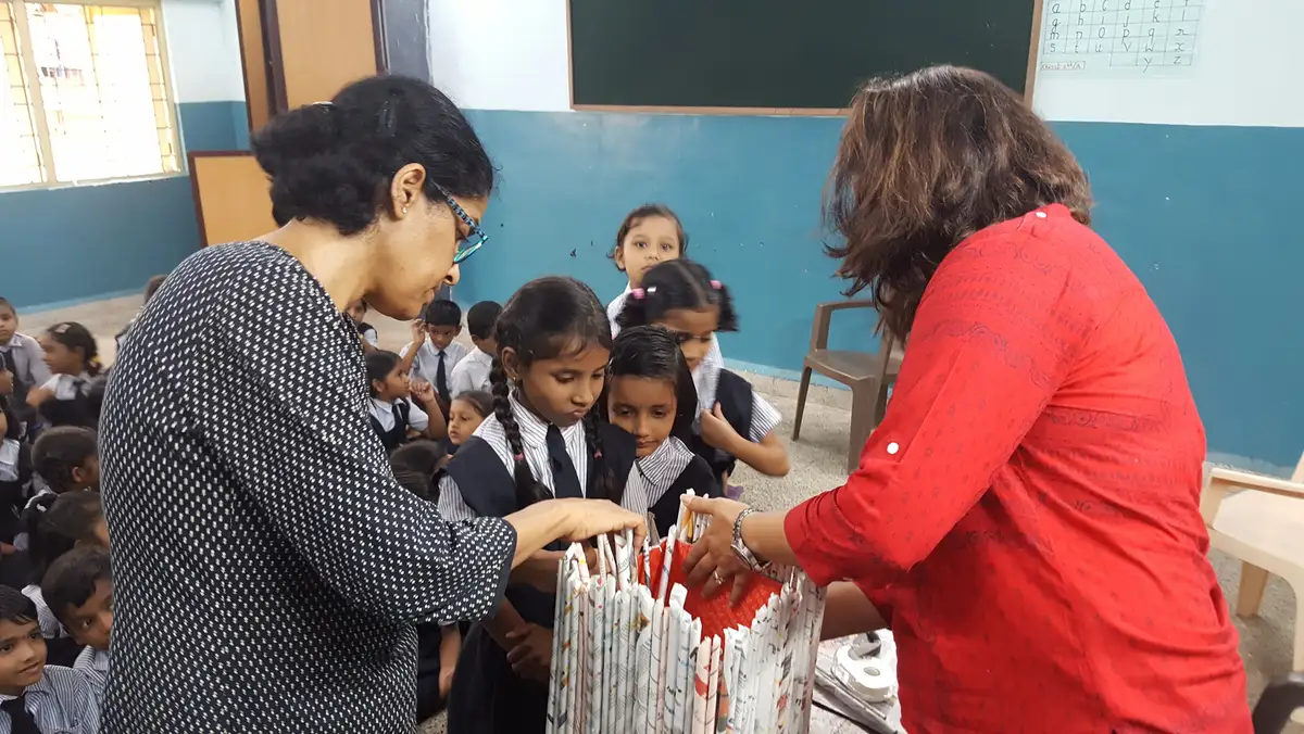 School children learning to make bags from waste newspaper in an Earth5R environmental education session