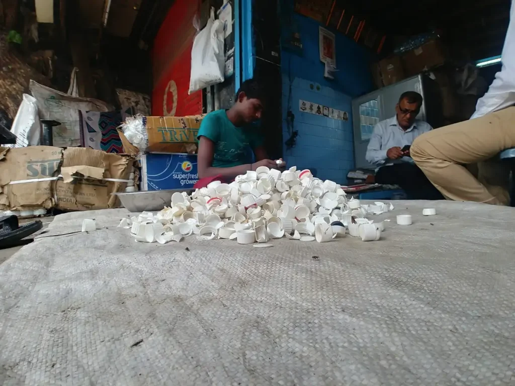 Plastic cups being sorted for recycling at an informal recycling unit in Mumbai, Earth5R CSR programme