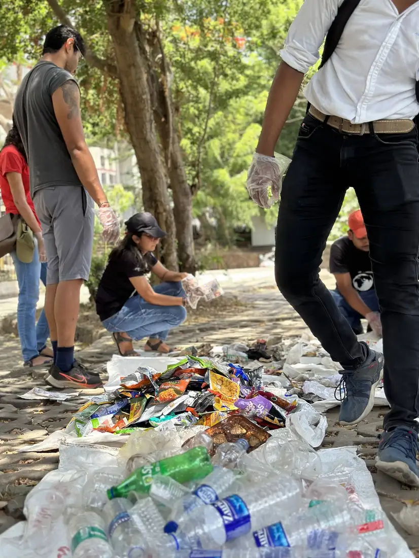 Segregated plastic bottles and wrappers from an Earth5R lake cleanup ready for recycling in Mumbai