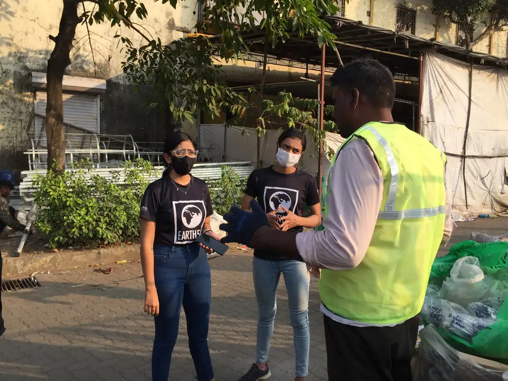 Water resources internship field work. Earth5R team training a waste collector on plastic recovery in the Mithi River catchment, Mumbai