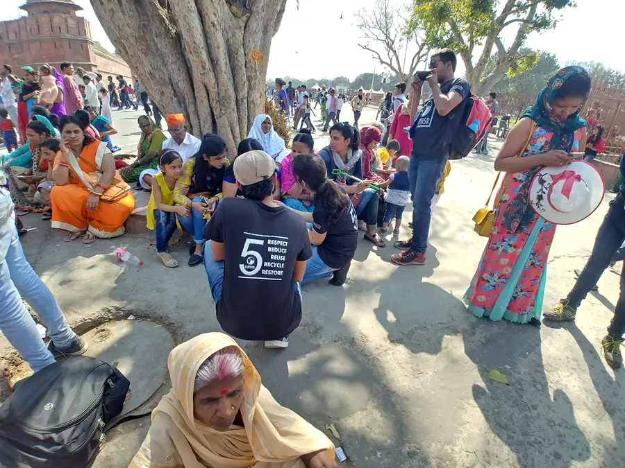 Earth5R volunteer in a 5R T-shirt training citizens on recycling in a public space in Delhi
