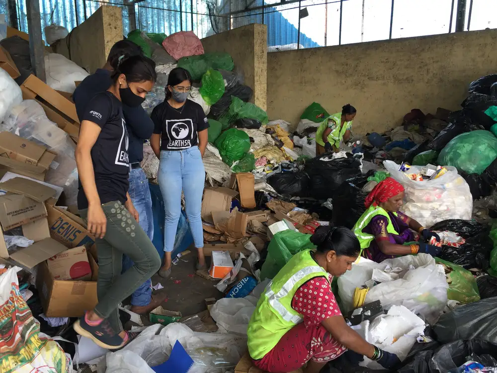 Earth5R team observing waste workers sorting dry waste for recycling at a material recovery facility in Mumbai, waste management and recycling