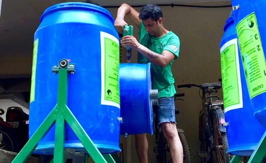 Saurabh Gupta building an Earth5R upcycled drum composter from an industrial container