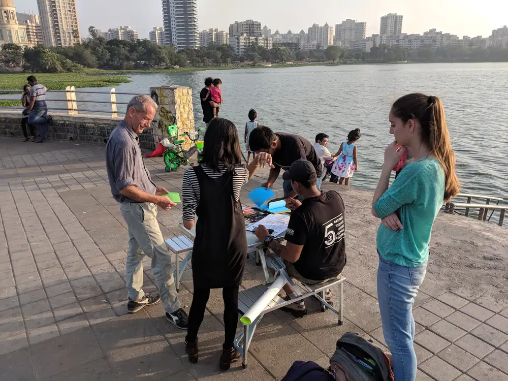 Entrepreneurship internship field work. Earth5R street hackathon setup by a lake where citizens develop climate solutions in Mumbai
