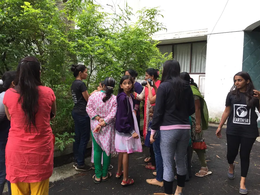 Earth5R volunteers with residents and children at an outdoor waste management session