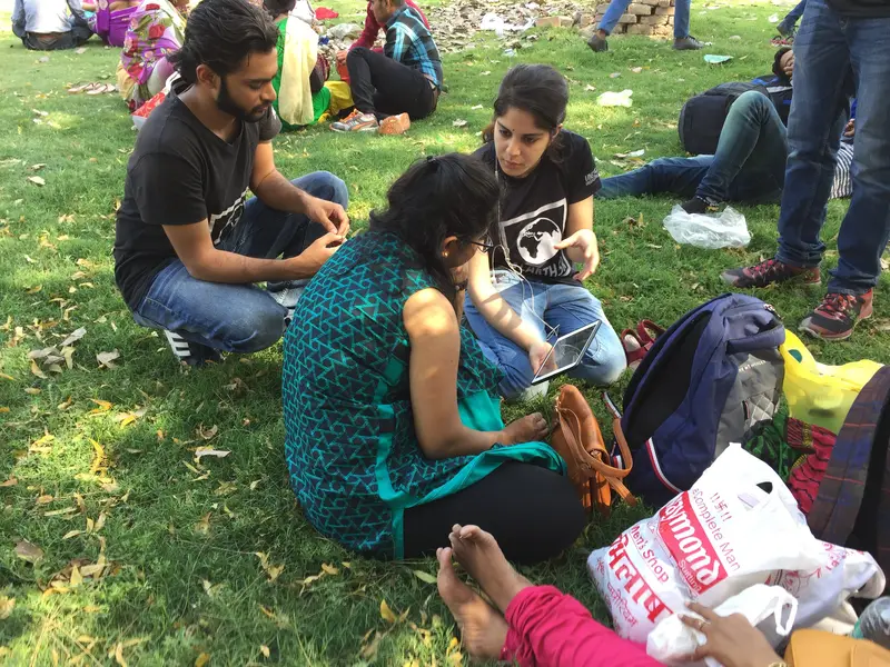 Earth5R volunteers training women on waste segregation on the lawns near the Red Fort, Delhi