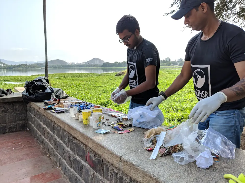 Earth5R volunteers segregating collected waste for an audit on the Powai Lake promenade in Mumbai