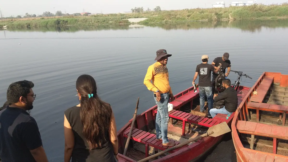 Earth5R volunteers preparing to cross the Yamuna River by boat for a cleanup in Delhi