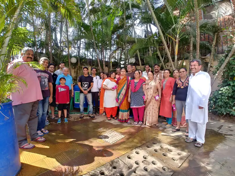 Housing society residents with the Earth5R team and a drum composter after going zero waste in Powai, Mumbai