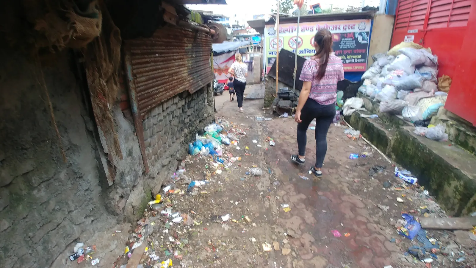 Public health internship field work. Garbage-strewn lane in an informal settlement, a target for community cleanup