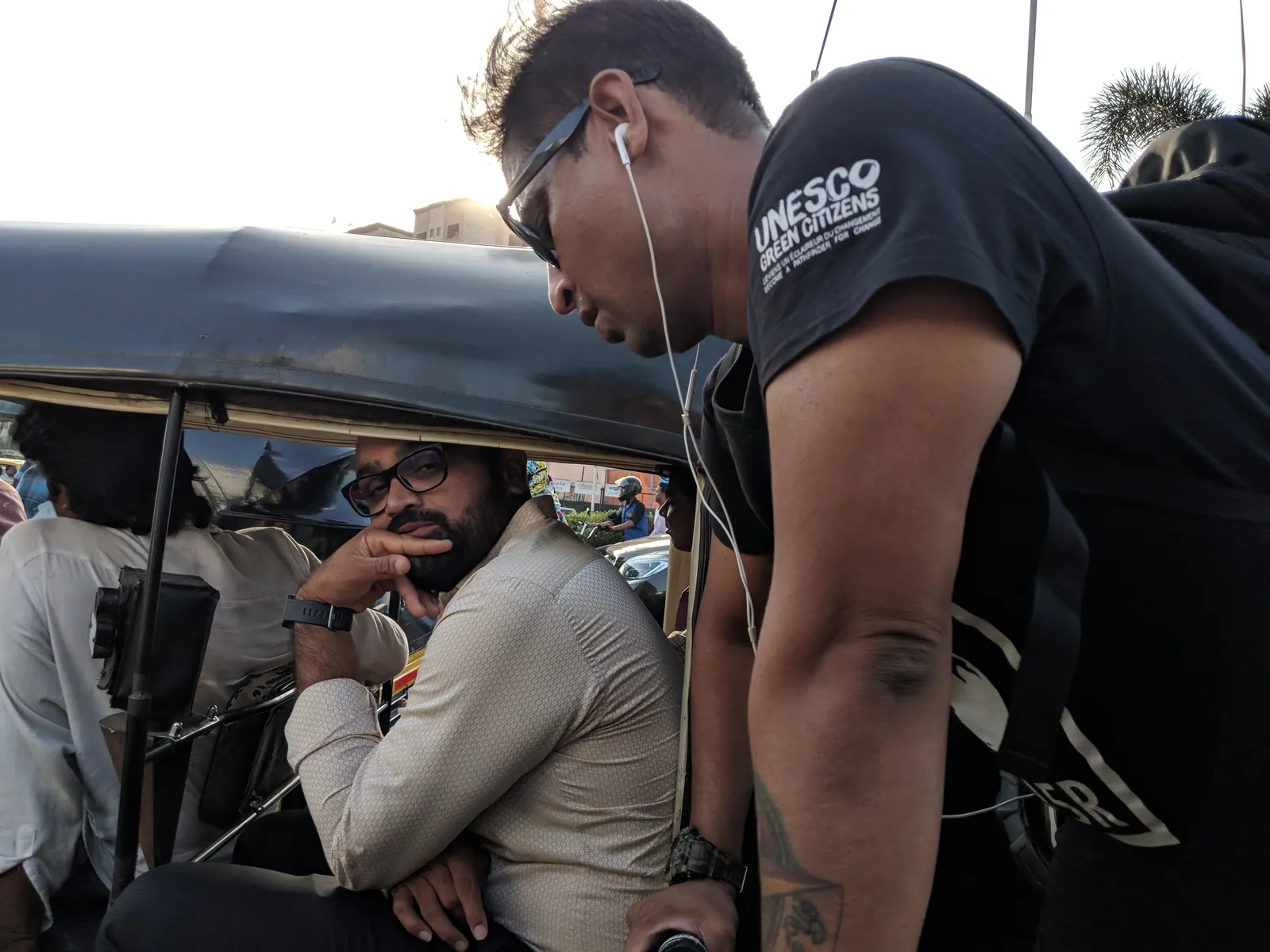 Journalism internship field work. Earth5R volunteer talking to an auto-rickshaw driver about littering and waste in Mumbai