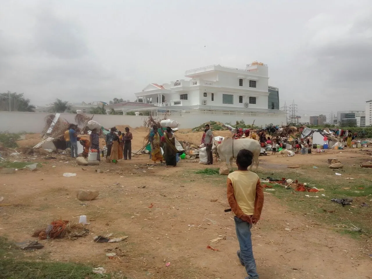 Open dumping ground on vacant land with scattered waste, a problem site for waste management work