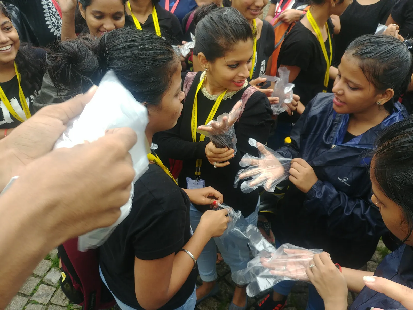 Students in gloves examining collected plastic for an Earth5R waste audit